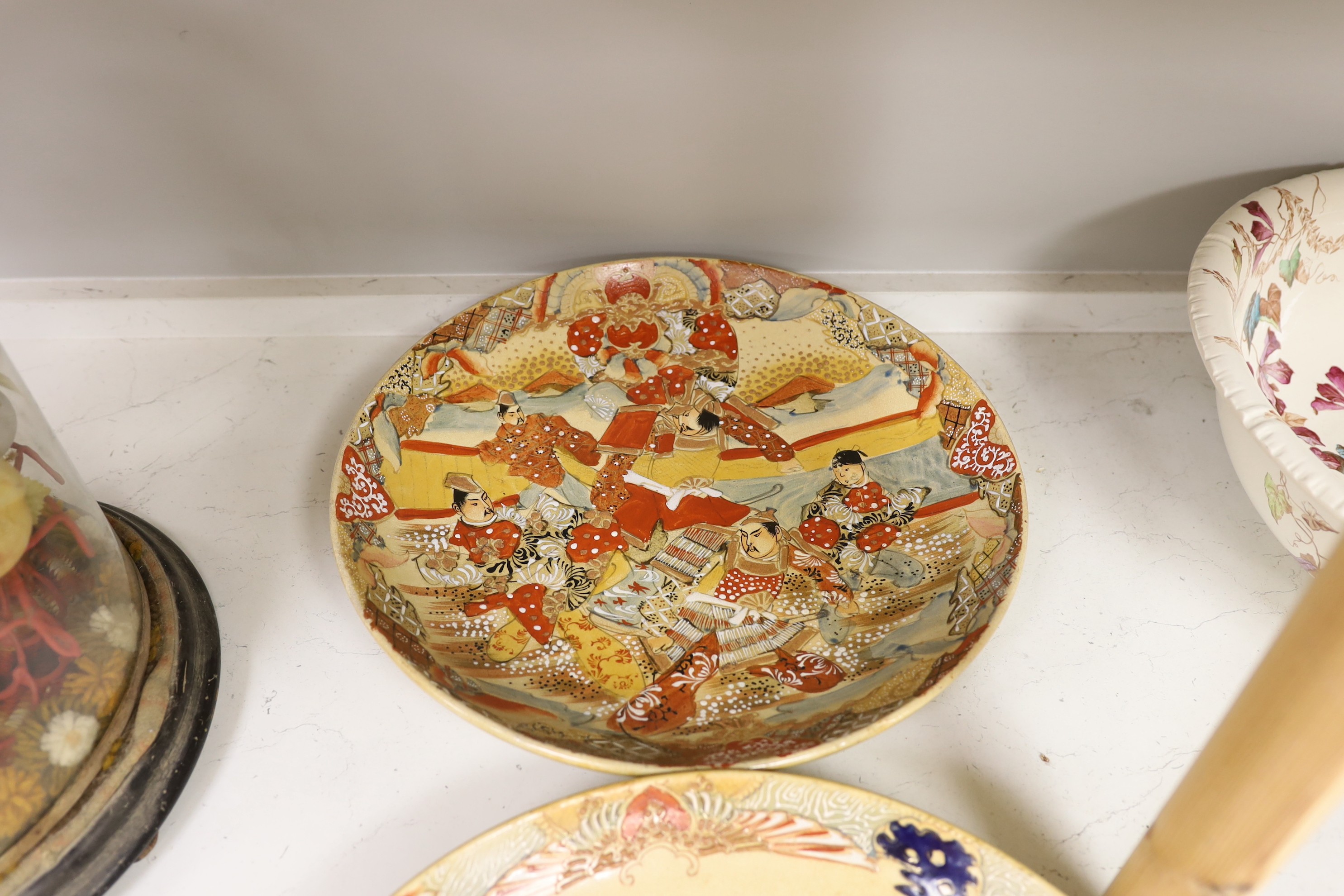 Two Japanese Satsuma pottery chargers. Largest 37cm diameter